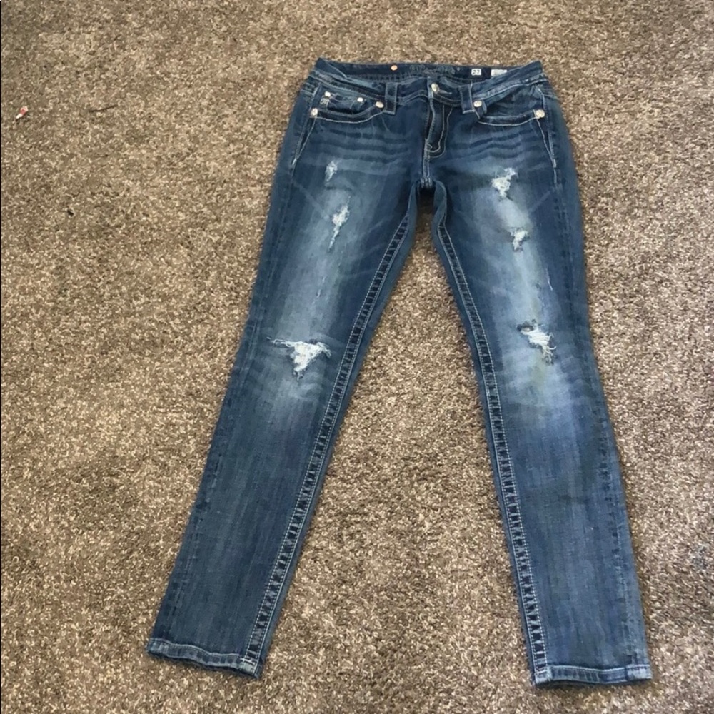 Mid-Rise Skinny MissMe jeans.